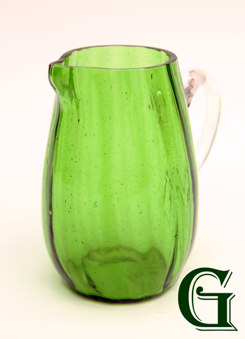 A GREEN GLASS JUG